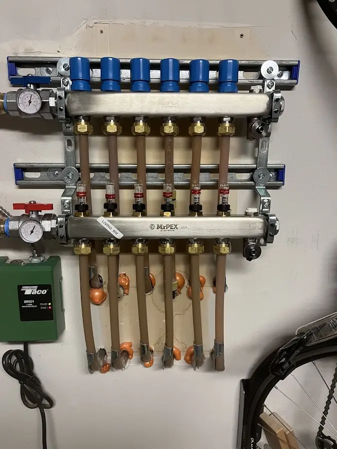 Plumber performing Water Heater Repair at a residential property in Plainville